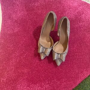 Betsey Johnson silver pumps.